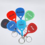 Ensemble de porte-clés en forme de raquette de padel de différents couleurs avec prénom